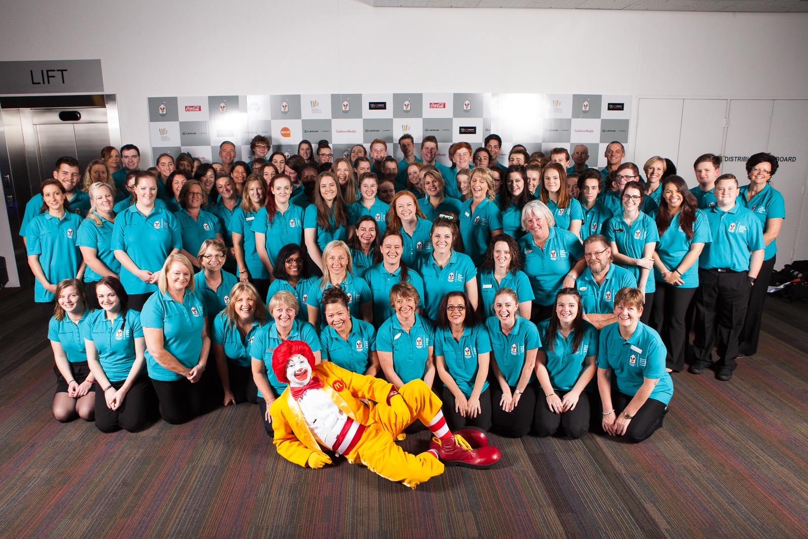 Volunteers at the Ronald McDonald house charity gala ball with Ronald McDonald himself