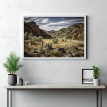 Venture into the rugged landscapes of the MacDonnell Ranges with this panoramic portrayal. This image presents an engaging interplay of craggy mountain terrain, textured rocks, and the expansive wilderness, all under the wide-open sky. This is more than a landscape—it's a bold and striking display of the untamed beauty of the Australian outback. Let this panorama whisk you away to the wild, where the harmony of rock and earth unfolds in the magnificent wilderness of the MacDonnell Ranges.