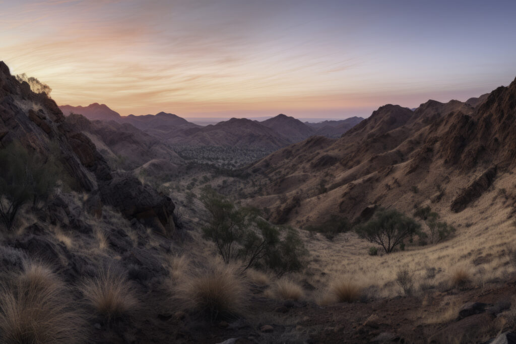 Experience the awe-inspiring beauty of the MacDonnell Ranges with this panoramic capture. The image masterfully weaves the rugged mountains, the expansive valley, and the untamed wilderness into a breathtaking vista. It's an outdoor spectacle that combines the raw grandeur of nature with the tranquil beauty of the Australian outback. This is more than a scenery—it's an invitation to journey into the heart of the wild, where every detail adds a unique verse to nature's melodious symphony.