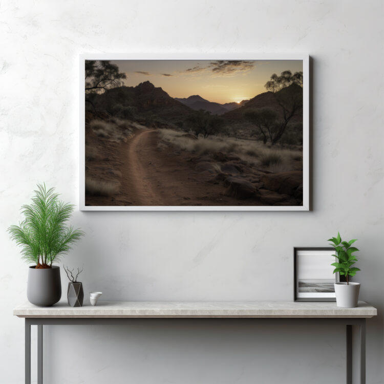 Journey into the stark beauty of the MacDonnell Ranges with this panoramic depiction. The expansive view captures the sweeping desert landscape, showcasing the intricate textures of the ground as it blends seamlessly into the untamed wilderness. The outdoor scene embodies the essence of the Australian outback, where the raw magnificence of nature is on full display. This isn't just a view—it's an intimate immersion into the austere splendour of an iconic desert landscape.
