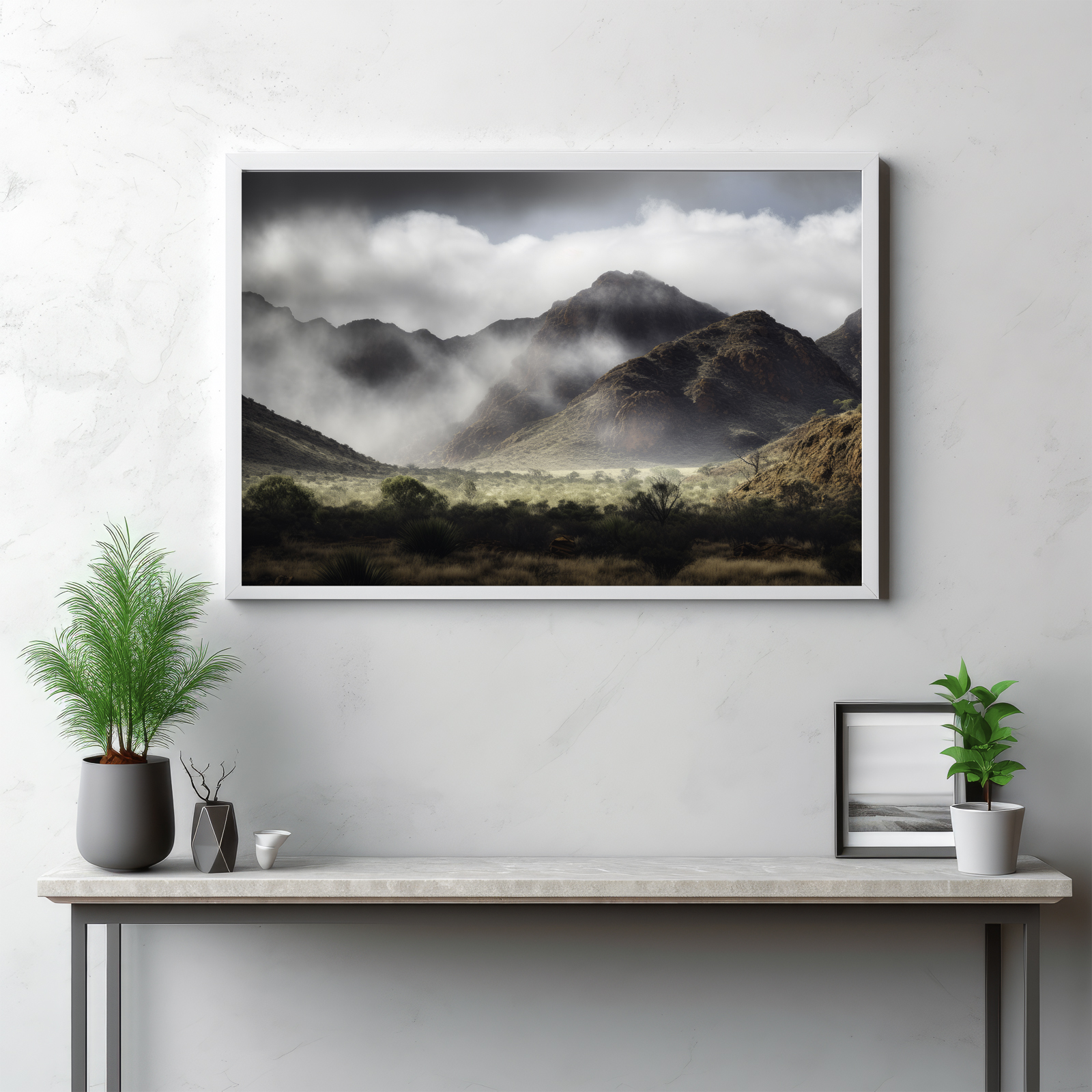 Step into the enigmatic realm of the MacDonnell Ranges, as captured in this atmospheric image. The grandeur of the mountain range, with its jagged peaks piercing through a serene blanket of fog, creates an ethereal spectacle. The weather enhances the scene's mystique, transforming the panoramic landscape into a whispering narrative of the wilderness. This is not just a view, but an immersive journey into the heart of nature's grandeur, mystically veiled in mist.