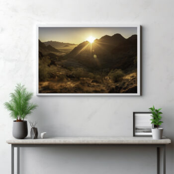 Embrace the mesmerizing spectacle of dawn breaking over the MacDonnell Ranges with this captivating image. The panoramic view frames the first light of day as it bathes the wilderness in golden sunlight, transforming the landscape into a living canvas. This is more than just an outdoor scene—it's a serene hymn to the awe-inspiring beauty of nature's daily rebirth. Begin your day with this stunning panorama, and let the tranquil beauty of the sunrise kindle your love for the grandeur of the Australian outback.