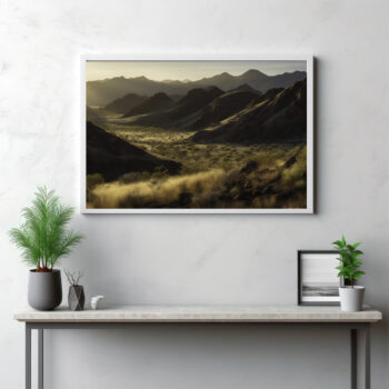 Dive into the grandeur of the MacDonnell Ranges with this panoramic snapshot. The image brings to life the dramatic peaks and mountain ranges rising from the rugged wilderness, under the sprawling outback sky. This is not just a landscape—it's a testament to the raw beauty of nature and the wild charm of the Australian outdoors. Let this panoramic view mesmerize you with its depiction of the mountain's majesty, inviting you on a journey through the breathtaking wilderness of the MacDonnell Ranges.